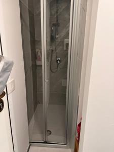 a shower with a glass door in a bathroom at Suite Aurora in Crotone +18 photos