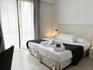 a bedroom with a large bed and a large window at Alcudia Petit - Turismo de Interior in Alcudia