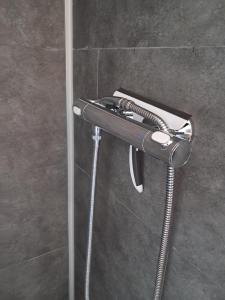 a wall mounted towel rack in a bathroom at LAETITIA ET CLAUDE in Lille +46 photos