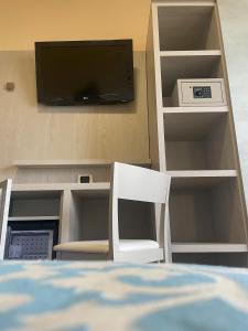 TV a/nebo společenská místnost v ubytování Hotel Costa Verde
