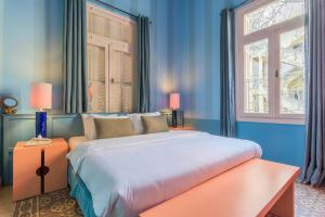 Ένα ή περισσότερα κρεβάτια σε δωμάτιο στο SAYA La Villa in Mar Mikhael +60 φωτογραφίες