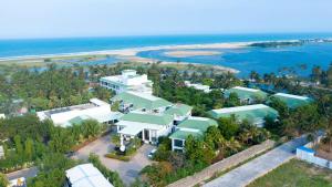 an aerial view of a house on the beach at Radisson Resort Pondicherry Bay in Pondicherry