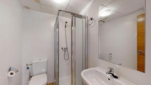 a bathroom with a shower and a toilet and a sink at Mar Menor Golf Resort in Murcia +15 photos