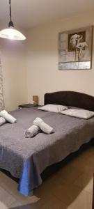 a bedroom with a bed with two towels on it at Apartments " Happy villa " in Splitska +63 photos
