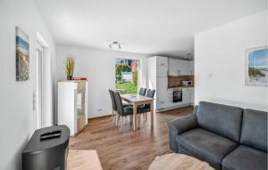 a living room with a couch and a table at Seehund Xl in Süssau