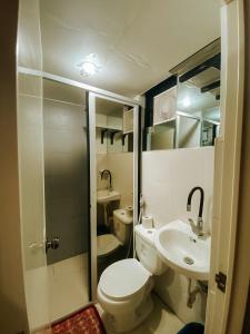 a small bathroom with a toilet and a sink at The River House - Govantes Guesthouse in Vigan +47 photos