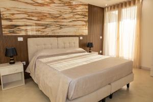 Postel nebo postele na pokoji v ubytování Global Hotel