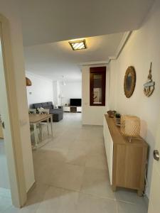 a living room with a couch and a table at Urbanización Altos de Nuevo Vera in Vera