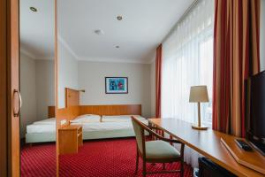 Postel nebo postele na pokoji v ubytování Hotel Mirage