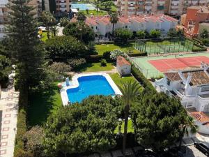 an aerial view of a resort with a swimming pool at Sea views from the bed Design studio in Torrox