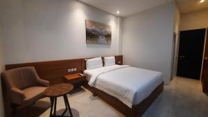 Postel nebo postele na pokoji v ubytování Gemma Hotel Balige