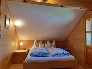 a bedroom with a bed in a attic at Ferienhof Brunbacher Wolfgangsee in St. Wolfgang +81 photos