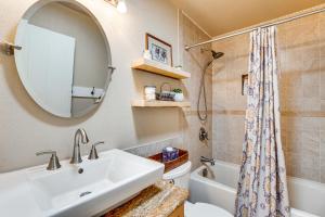 a bathroom with a sink and a toilet and a mirror at Hot Tub, Wineries, Mtn Views Palisade Home! in Palisade +24 photos