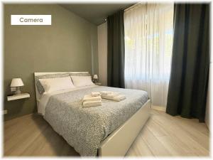 Кровать или кровати в номере La Brezza Home Sanremo