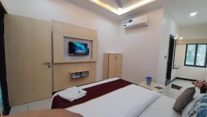 Voodi või voodid majutusasutuse Hotel Sun Palace toas