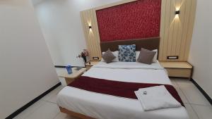 Voodi või voodid majutusasutuse Hotel Sun Palace toas