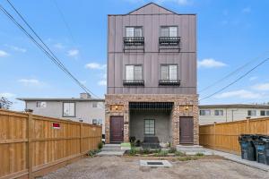 a tall building with a fence in front of it at Casa Ladrillo - House of Bricks in Calgary