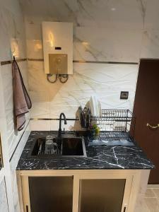 a kitchen with a sink and a counter top at Studio Jouri in Rabat