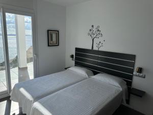 A bed or beds in a room at Agi Joan Margarit