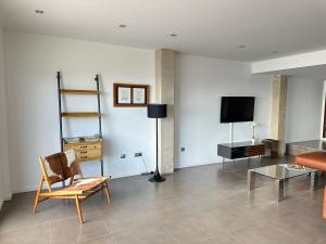 A television and/or entertainment centre at Agi Joan Margarit