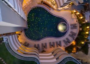 an aerial view of a building with a pool of water at Aquila Porto Rethymno in Rethymno