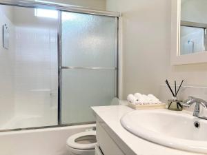 a white bathroom with a sink and a toilet at Bohemian Dream- 2BR, Retreat Near Hollywood -BR6 in Los Angeles