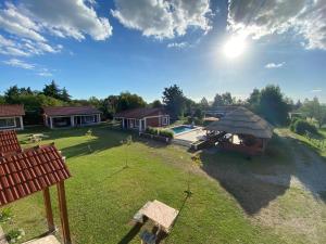 an aerial view of a house with a yard at Nuova Costa Cabañas in Los Molles
