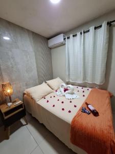 Postel nebo postele na pokoji v ubytování Flat Milagres Bontempo