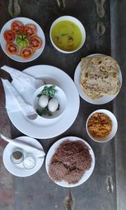a group of plates of food on a table at Jana Villa 21 in Bentota