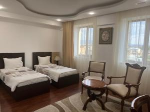 Postel nebo postele na pokoji v ubytování Vanatur Hotel