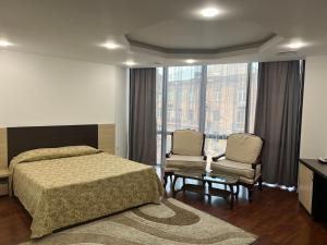 Postel nebo postele na pokoji v ubytování Vanatur Hotel