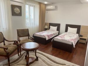 Postel nebo postele na pokoji v ubytování Vanatur Hotel