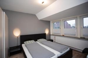 Postel nebo postele na pokoji v ubytování Haus Schulz