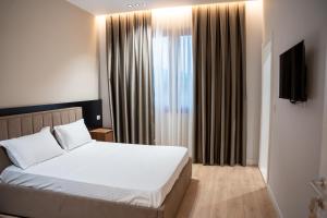 Postel nebo postele na pokoji v ubytování Hotel EuroStiven + 37 fotografií