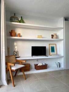 Μια τηλεόραση ή/και κέντρο ψυχαγωγίας στο Casa Costa Apartments