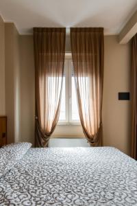 Postel nebo postele na pokoji v ubytování Hotel Daina + 8 fotografií
