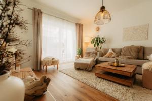 a living room with a couch and a table at PauliDrei in Leipzig