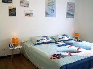 a bedroom with a bed with pillows on it at Ferienwohnung am Ellerbach in Hessisch Oldendorf