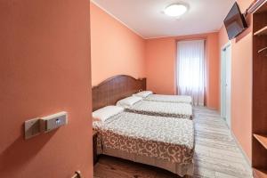 Posteľ alebo postele v izbe v ubytovaní Hotel Italia