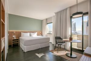 Cama ou camas em um quarto em INNSiDE by Meliá São Paulo ITAIM