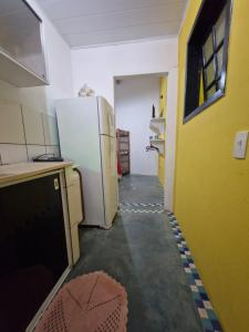 Kuchyň nebo kuchyňský kout v ubytování Pousada Familia Viva Trindade