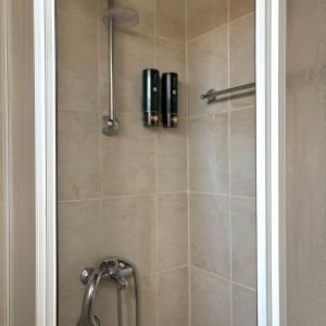 a bathroom with a shower with a shower head at Levanda House - Traditional House Vasa Koilaniou in Vasa Kilaniou +24 photos