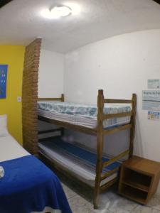 Postel nebo postele na pokoji v ubytování Pousada Familia Viva Trindade