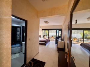 a room with a door open to a living room at Pensiunea Maria Teodora in Eşelniţa +54 photos