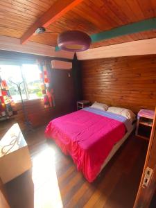 Una cama o camas en una habitación de The Host Puerto Iguazú
