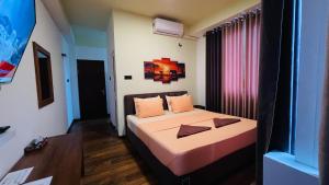 Voodi või voodid majutusasutuse Sun Dove Suite toas