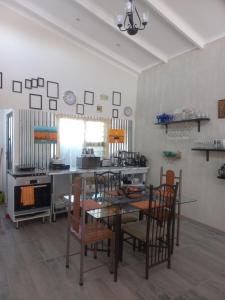 a dining room with a table and chairs at Bedrock Accommodation in Gansbaai