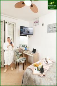 TV a/nebo společenská místnost v ubytování B&B Casaffitti