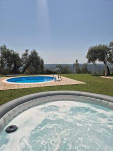 a hot tub in a backyard with a playground at L' INCANTO in Penna in Teverina