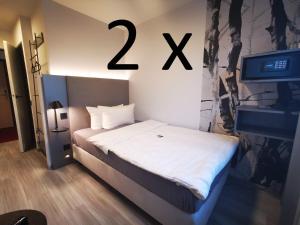 Postel nebo postele na pokoji v ubytování Hotel Grille